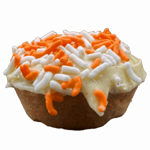 Orange sugar cookie with orange creamsicle frosting, lemon zest, and sprinkles on top.