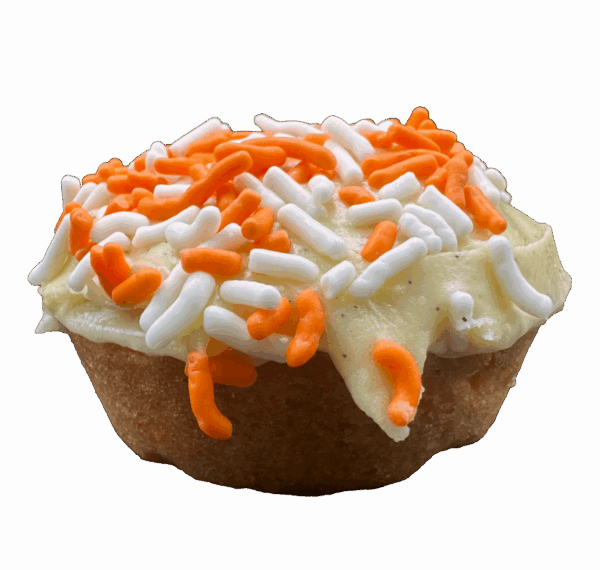Orange sugar cookie with orange creamsicle frosting, lemon zest, and sprinkles on top.