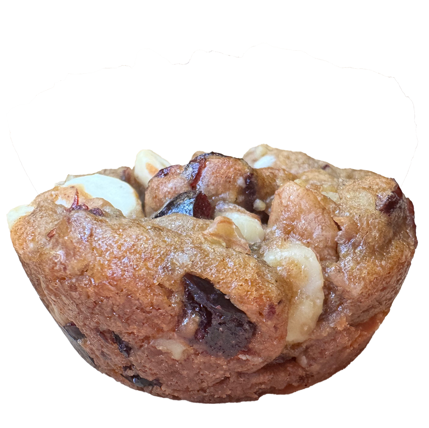 A golden brown cookie with white chocolate chunks and cranberries.